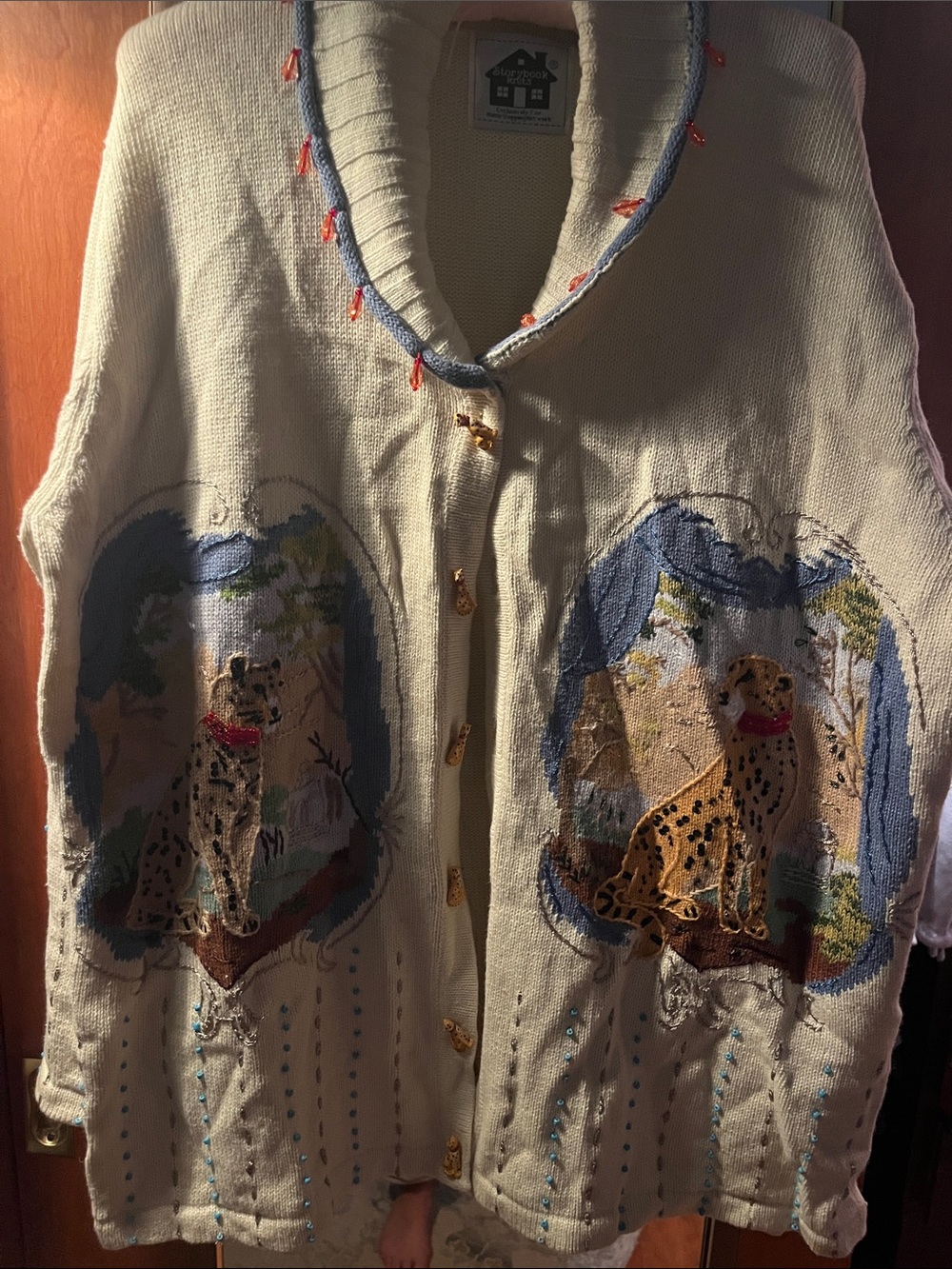Storybook Knits Cream Cardigan with Blue and Orange Accents